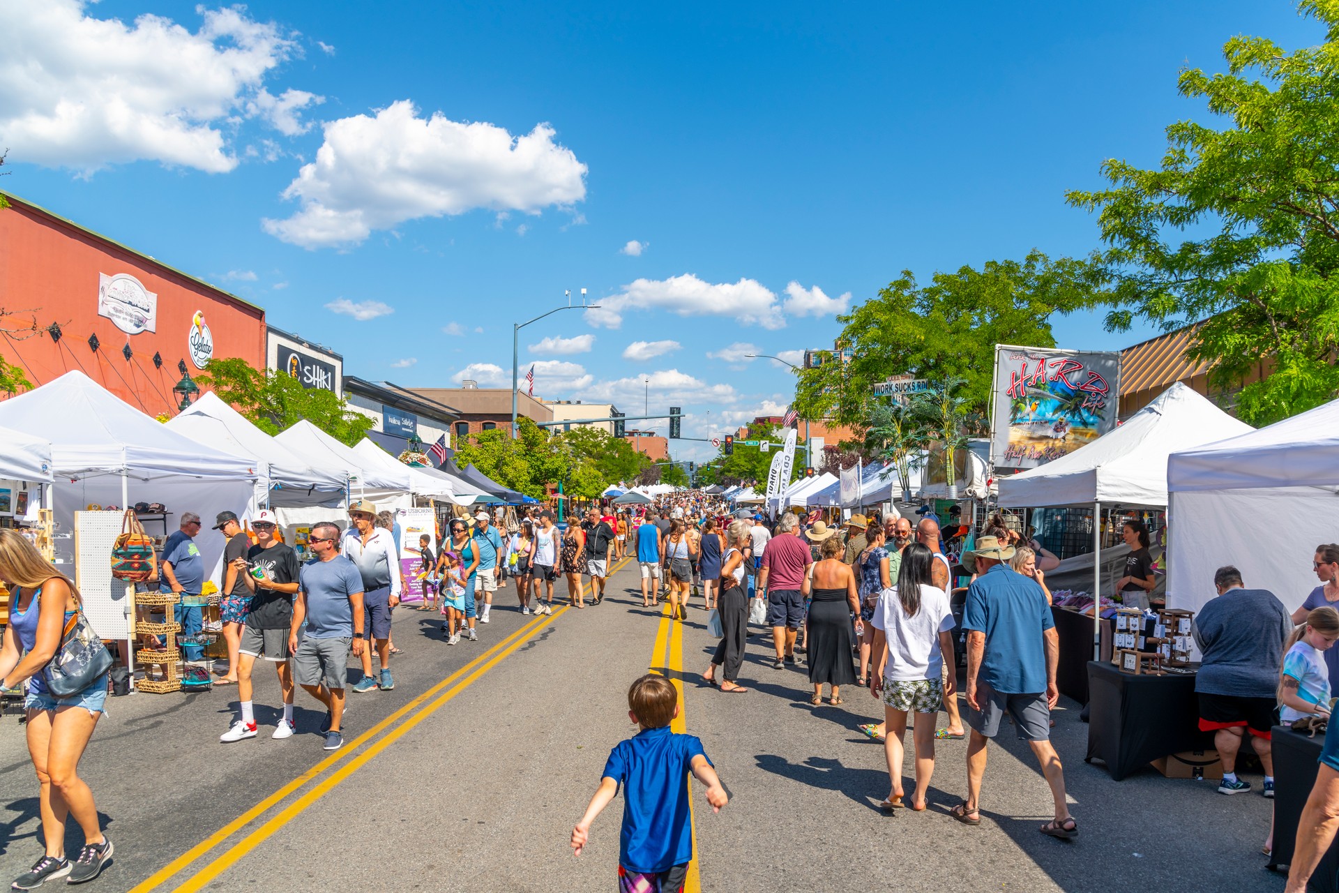 The annual Arts and Crafts Street Fair with vendors selling food, gifts and art products along main street Sherman Avenue, and through city park in the lakefront tourist resort town of Coeur d'Alene, Idaho.